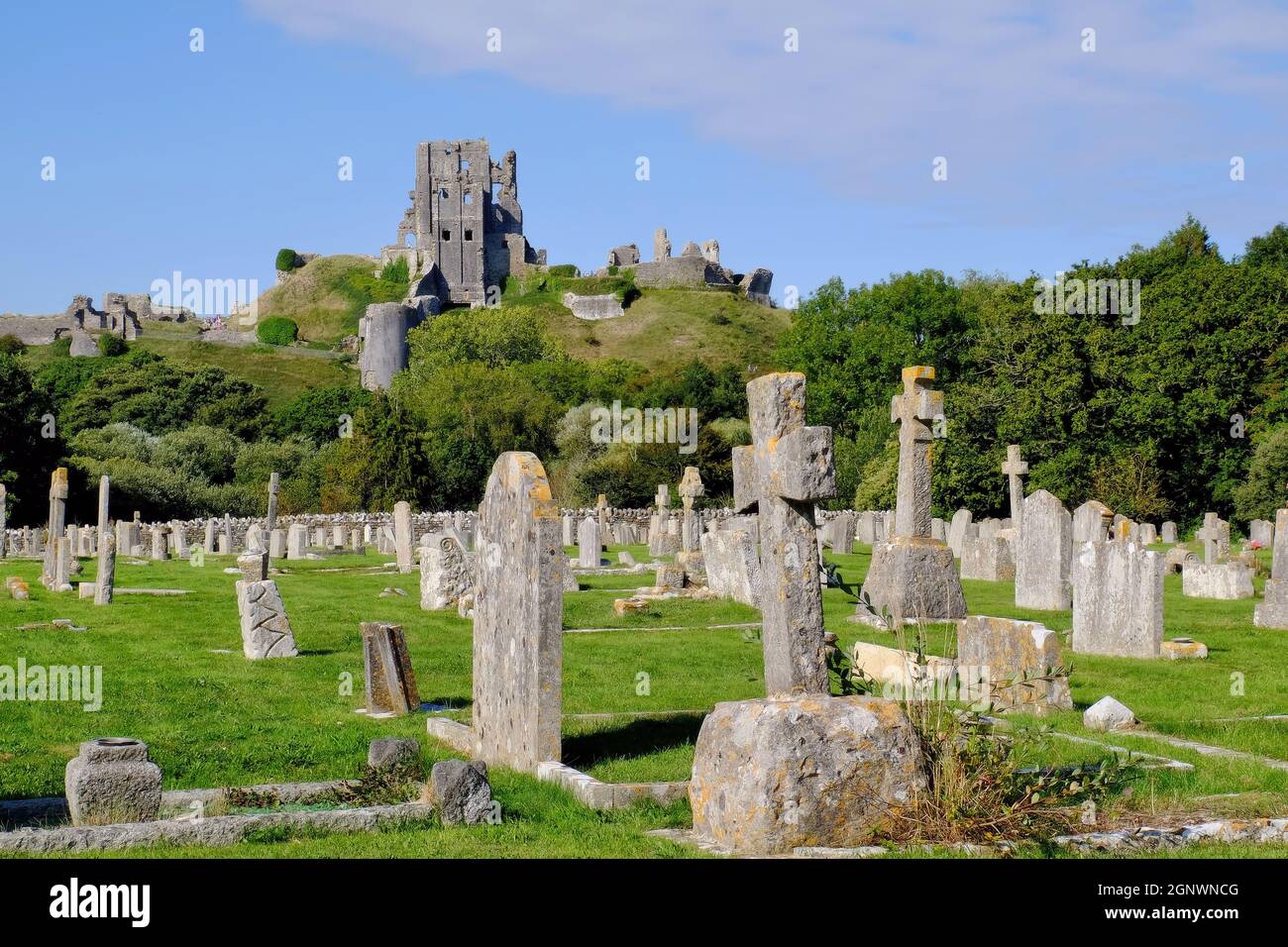 View of Corfe Castle and cemetery at Corfe Castle, Isle of Purbeck, Dorset, England Stock Photo