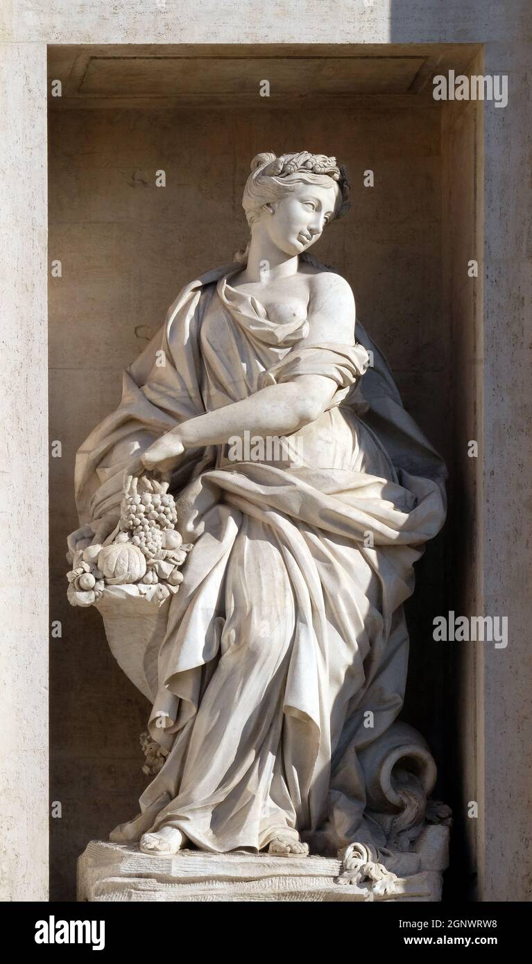 The statue of Abundance of the Trevi Fountain in Rome. Fontana di Trevi is one of the most