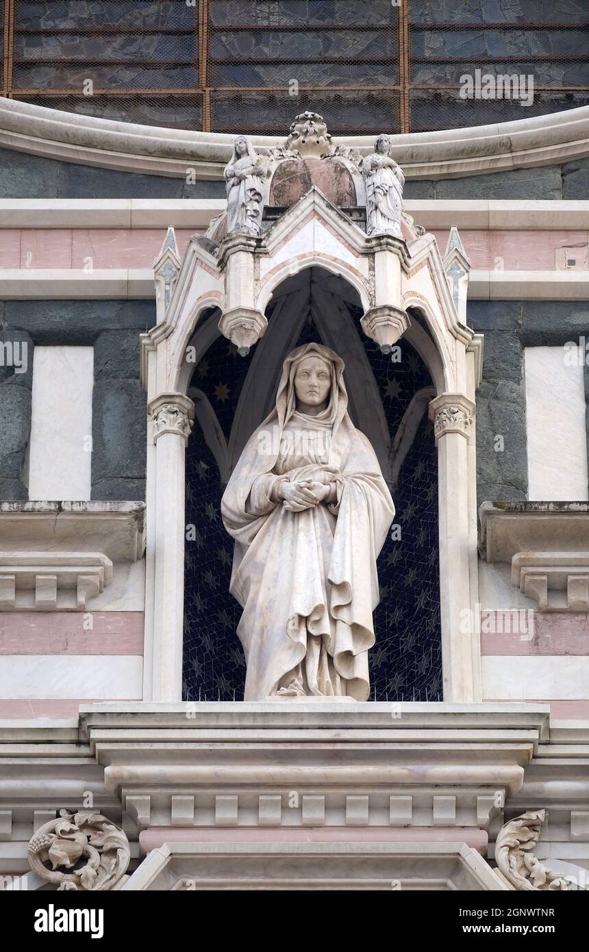 Statue on the portal of Basilica of Santa Croce (Basilica of the Holy Cross) - famous Franciscan church in Florence, Italy Stock Photo