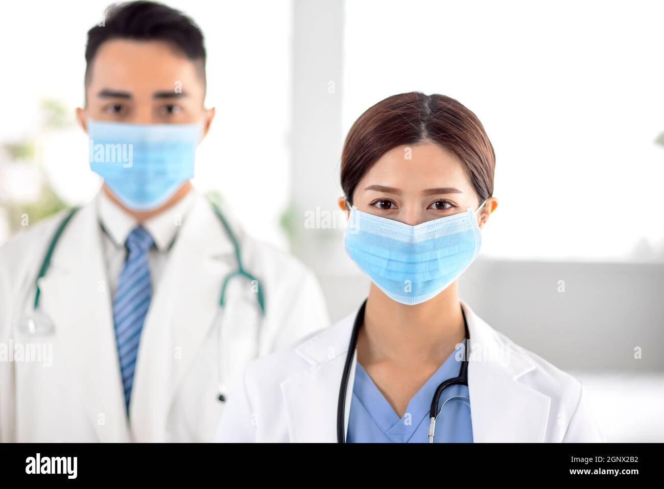 doctors faces wearing protective mask in Hospital Stock Photo