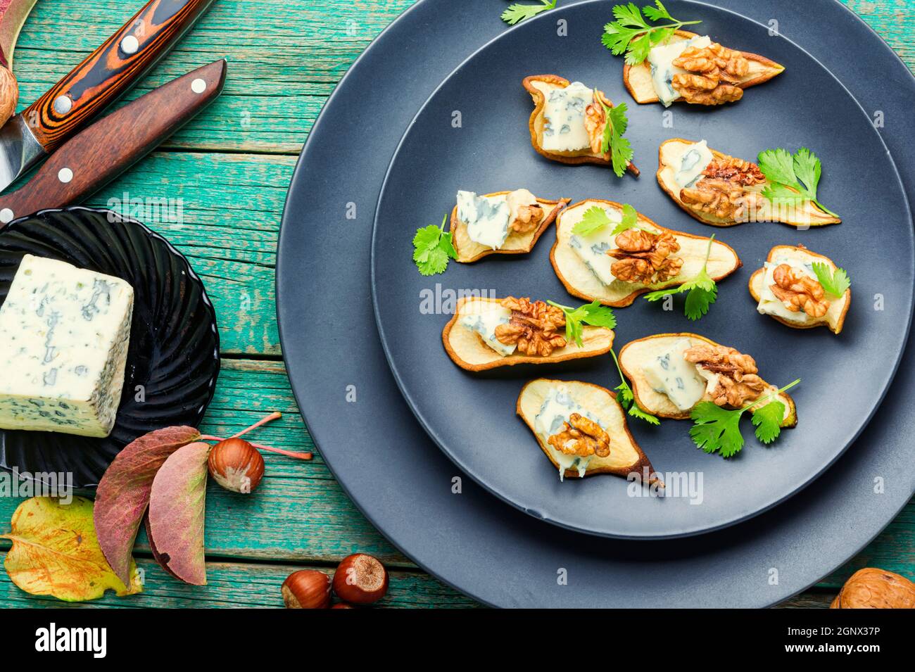 Dry pear,blue cheese and walnut appetizer.Sliced dried pear pieces