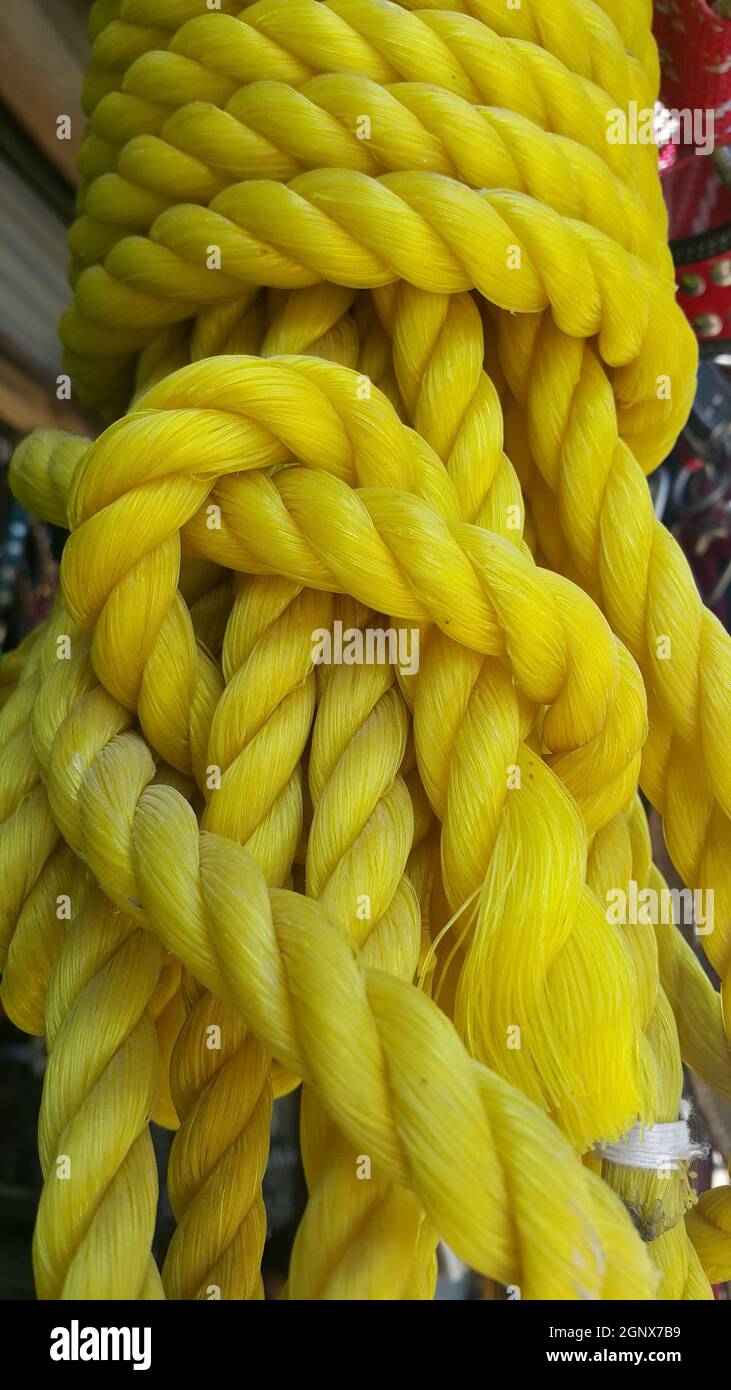 Closeup of bright color braided plastic ropes. Hanks or coil of bright  colored plastic rope interwoven which are used for climbing and tightening  mate Stock Photo - Alamy