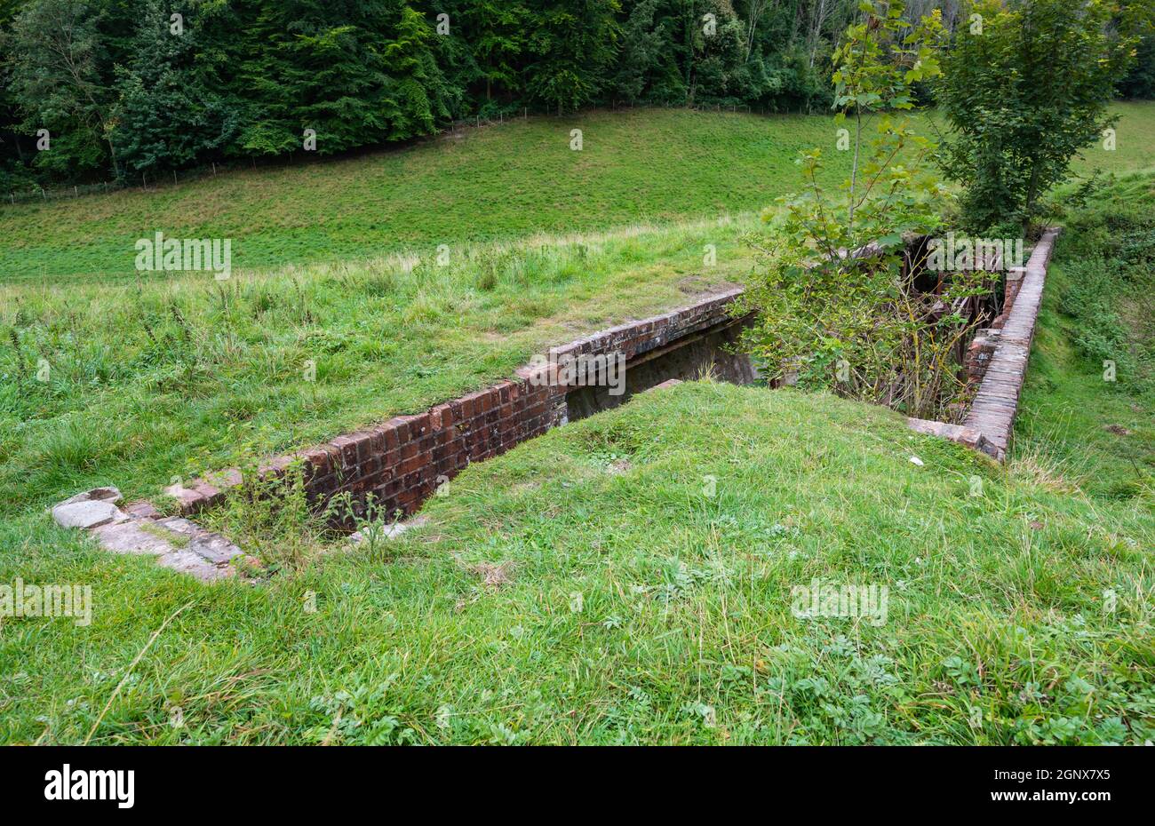 Old historic rusting ruins of shooting targets in underground shelter used on a rifle range in Arundel Park (Norfolk Estate), South Downs, UK. Stock Photo