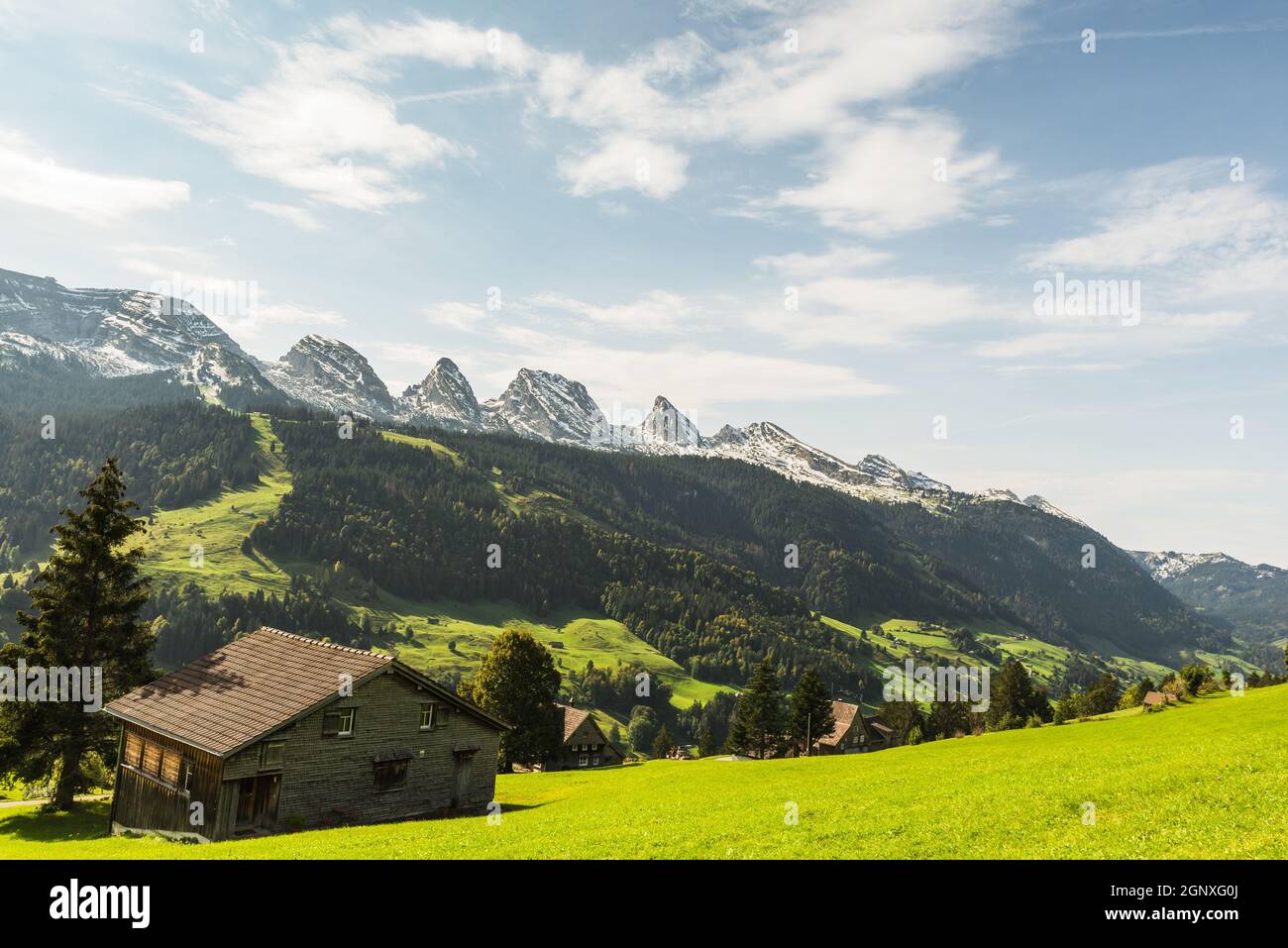 Landscape in Toggenburg with pastures and alpine hut. View of the Churfirsten mountain range, Unterwasser, Wildhaus-Alt St. Johann, Canton of St. Gall Stock Photo