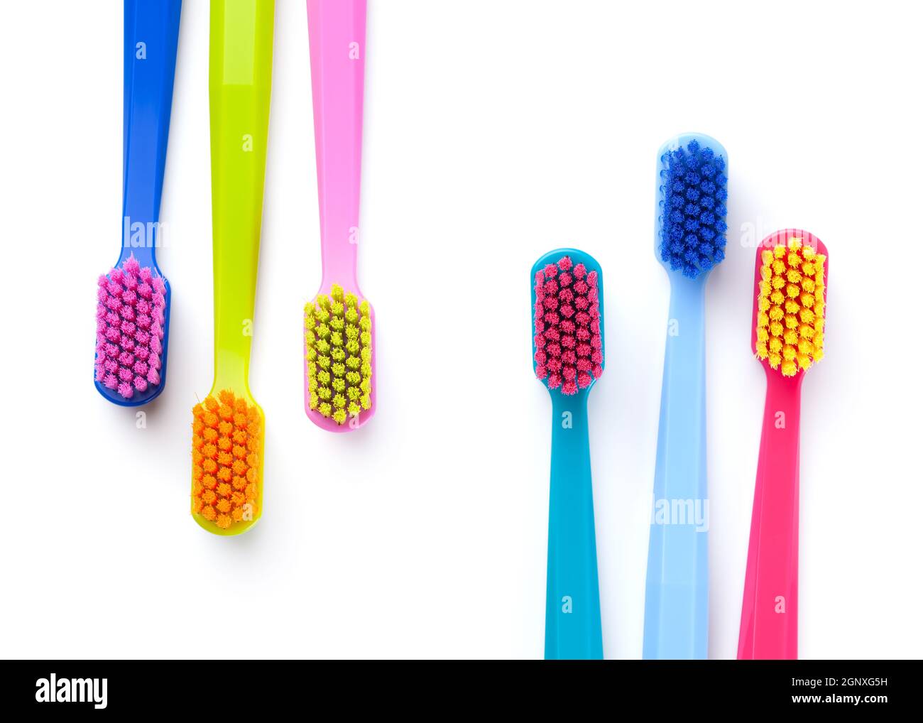 Colorful new toothbrushes isolated on white background. Top view Stock ...