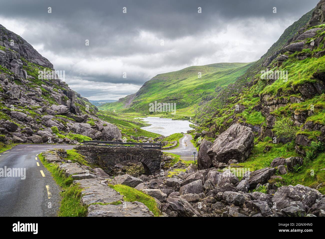 Narrow winding road and stone bridge with a view on Gap of Dunloe valley  and lake in Black Valley, Ring of Kerry, County Kerry, Ireland Stock Photo  - Alamy