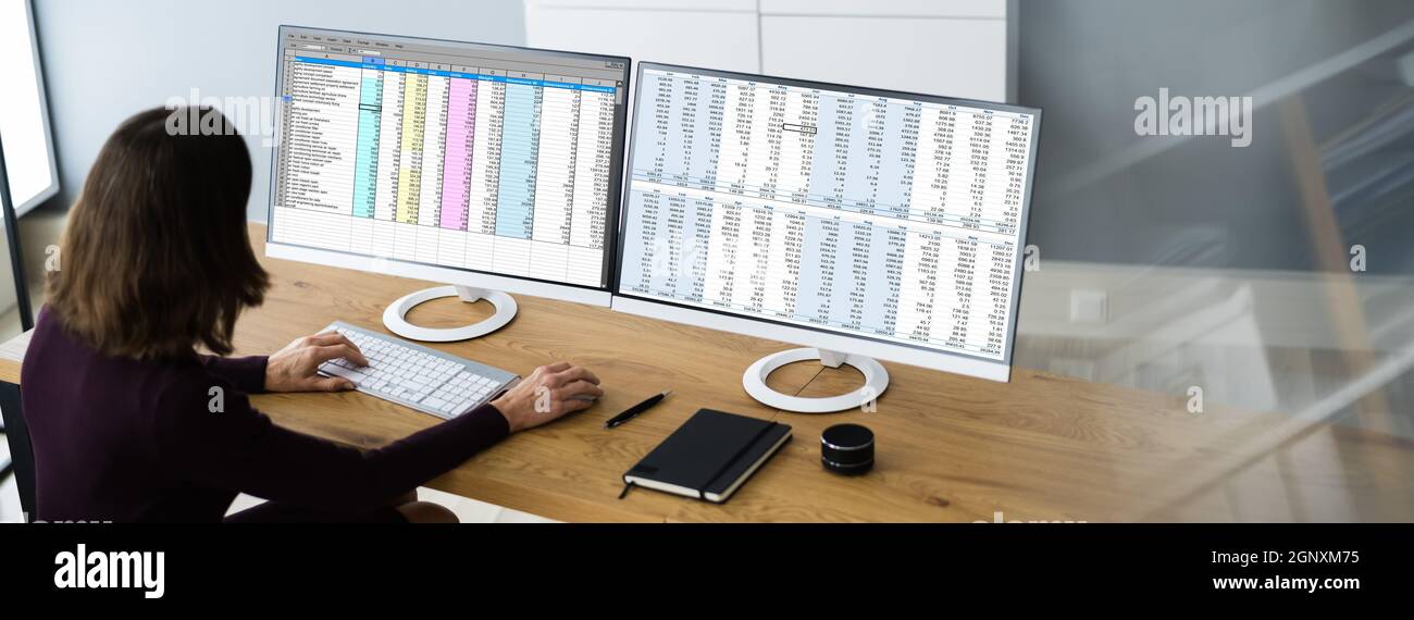Analyst Employee Working With Spreadsheet On Computer Screen Stock Photo
