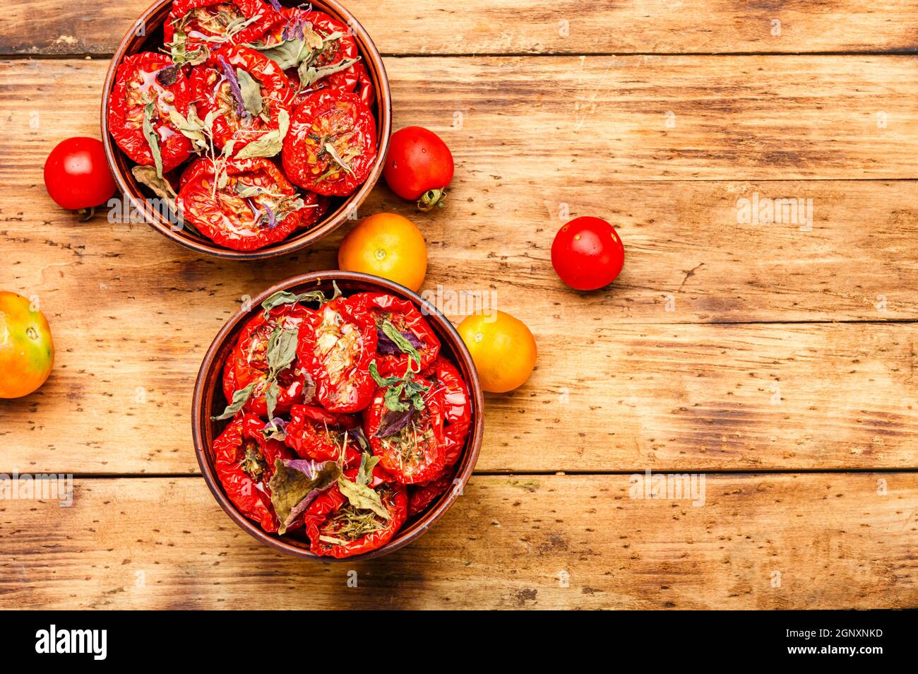 Sun dried tomatoes with herbs and spices Stock Photo Alamy