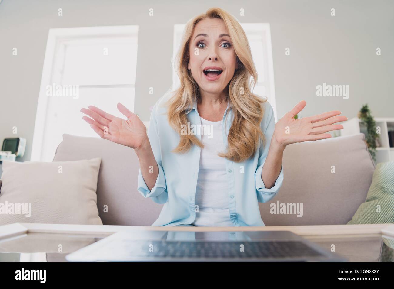 Photo of happy amazed crazy businesswoman have online meetings hear unexpected news information distance work at home Stock Photo