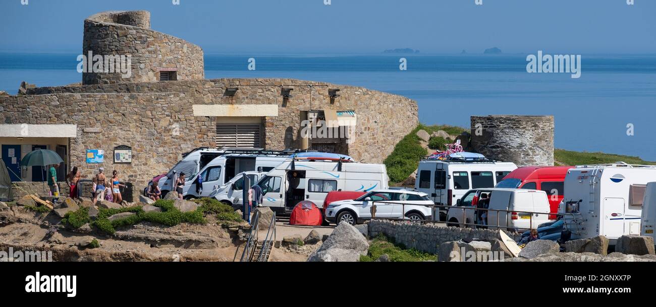 A panoramic image of a full car park on Towan Head in the summer holiday season in Newquay in Cornwall. Stock Photo