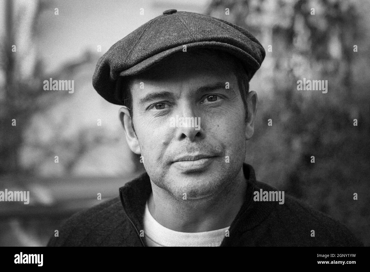 Portrait of good looking man with flat cap Stock Photo