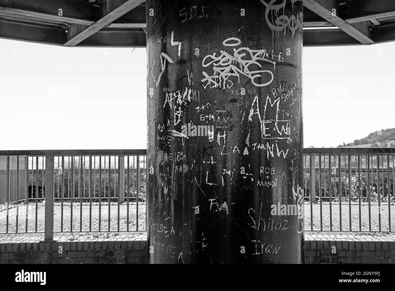 Monochrome image of Urban art in the form of graffiti on the central pillar of the Viewpoint Point at Mount Wise Devonport, overlooking the Hamoaze an Stock Photo