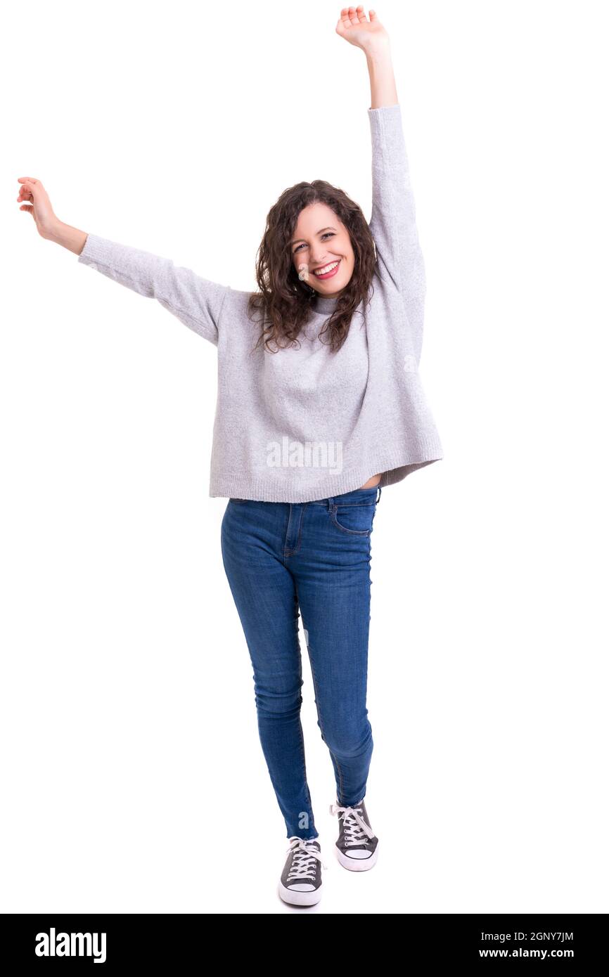Studio shot: Happy woman with raised arms Stock Photo - Alamy