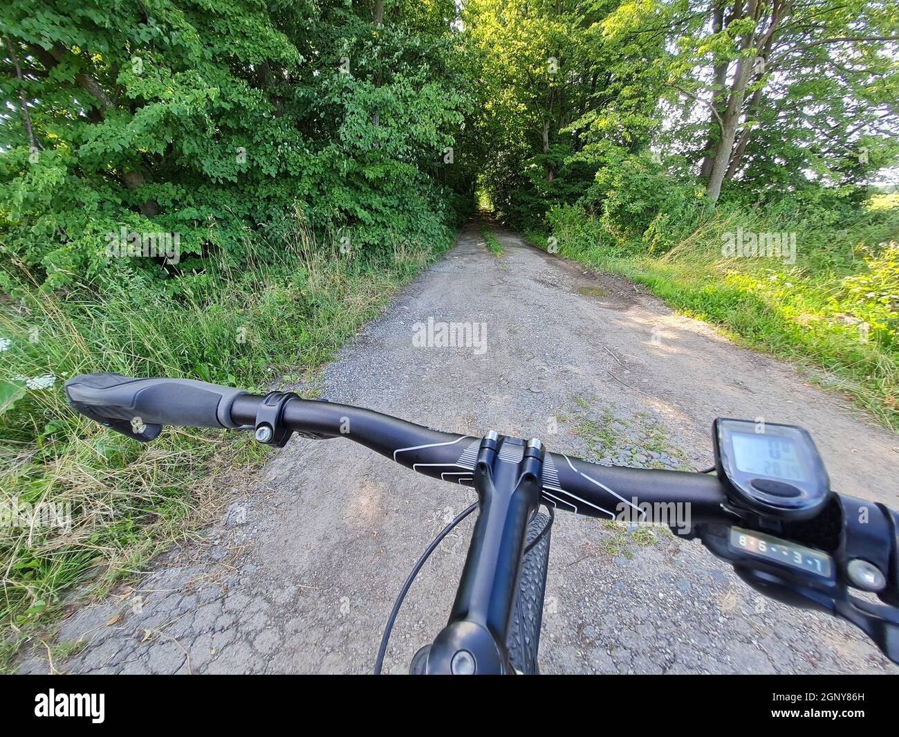 bicycle wheel on gravel road background closeup Stock Photo Alamy
