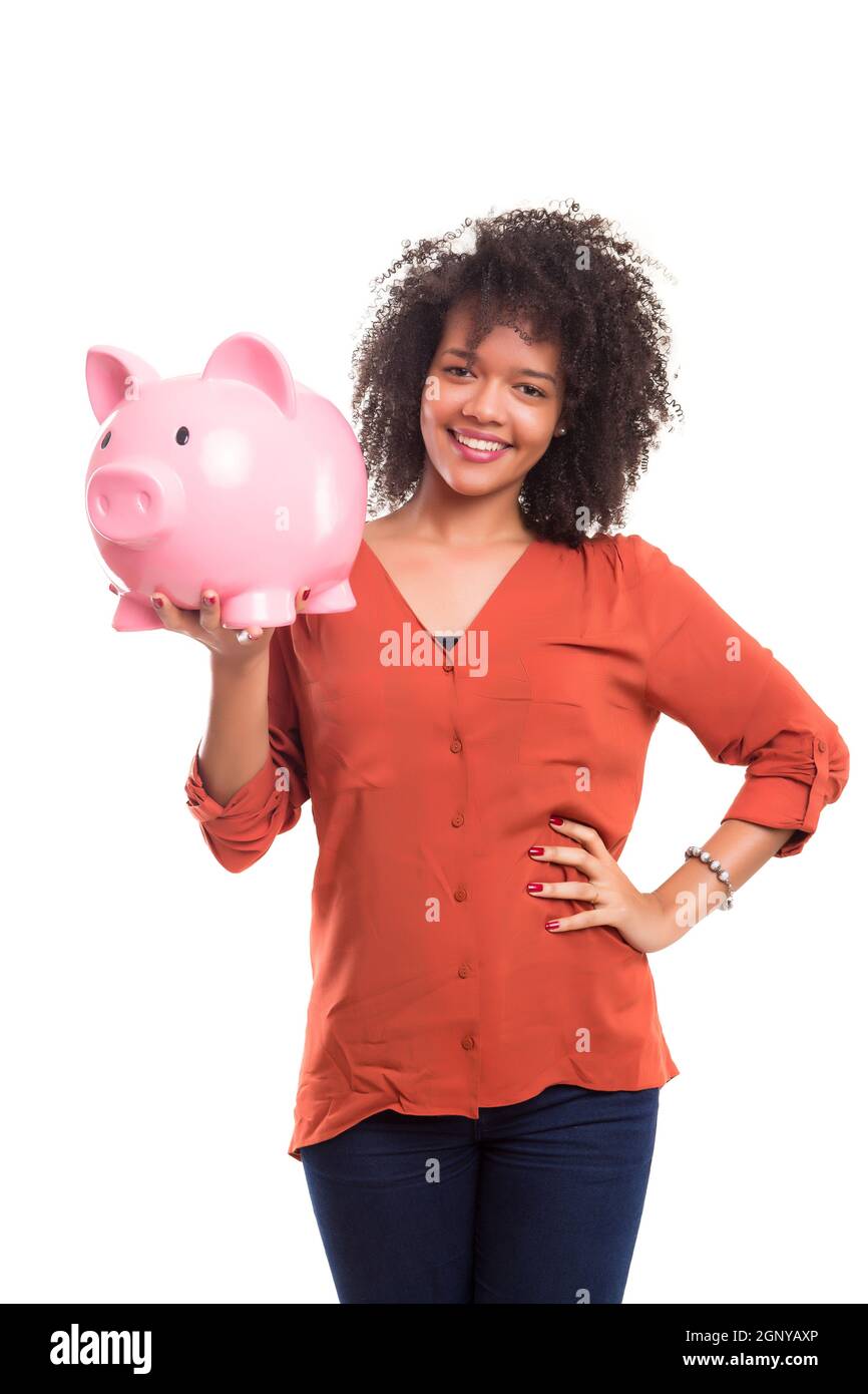 African woman putting some money into a piggy bank Stock Photo - Alamy