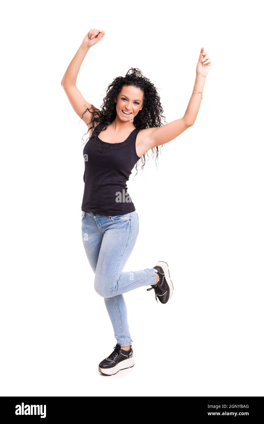 Studio shot: Happy woman with raised arms Stock Photo - Alamy