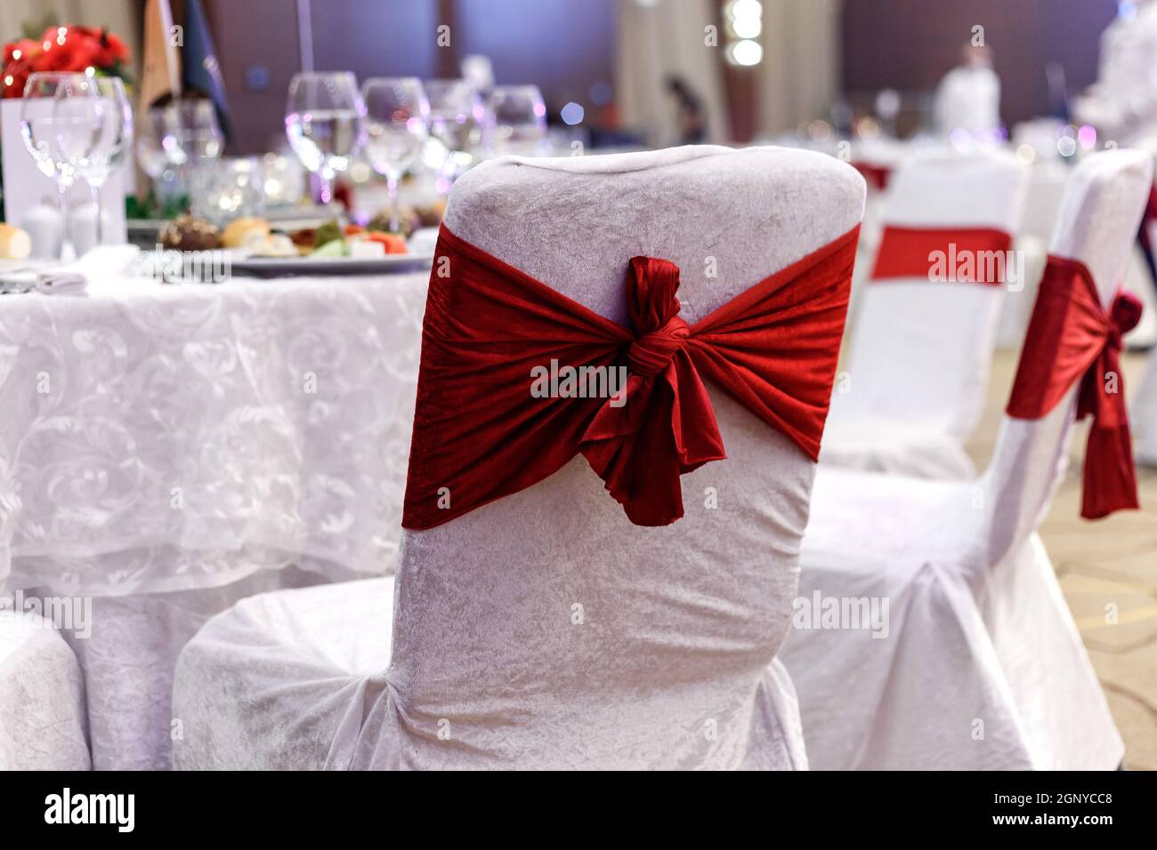 Festive round table setting in a prestigious restaurant for dinner