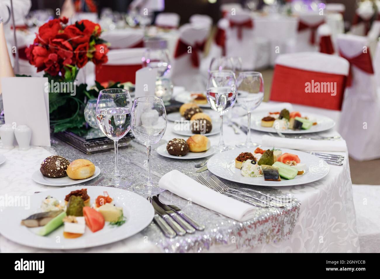Festive round table setting in a prestigious restaurant for dinner