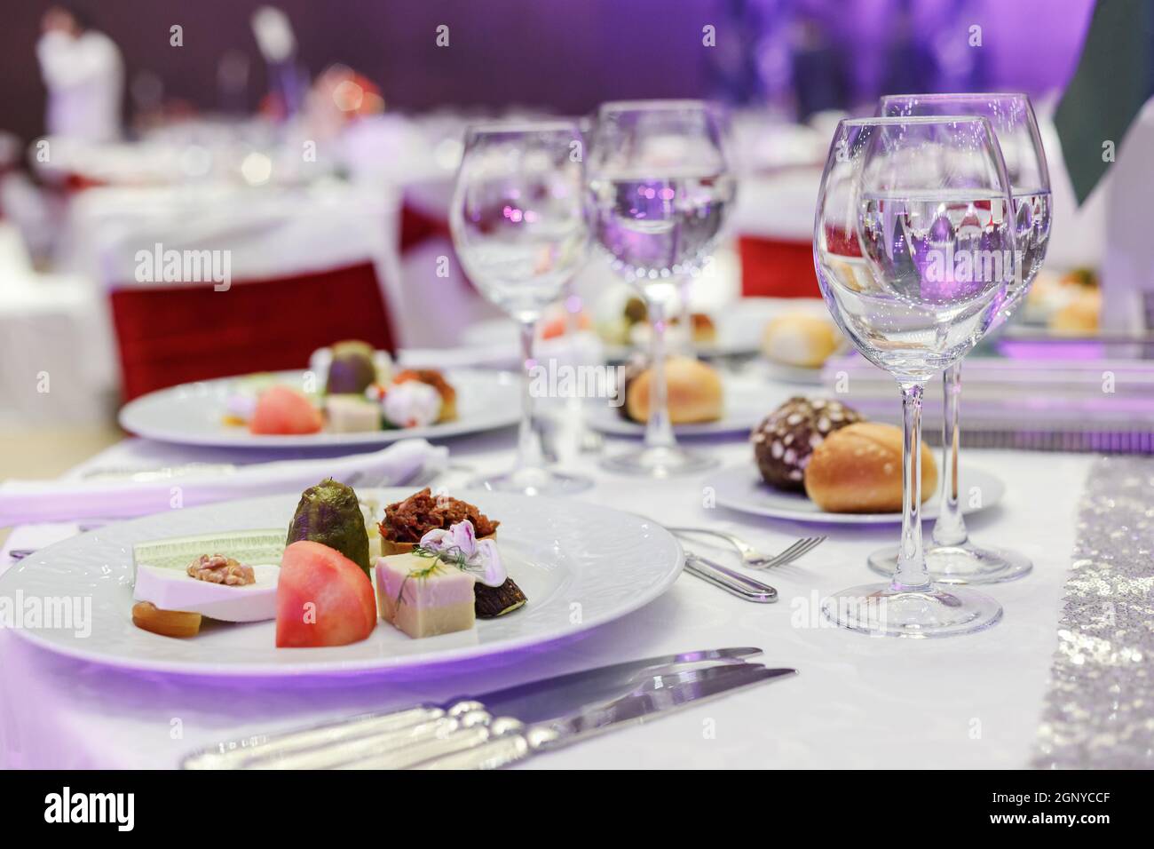 Festive round table setting in a prestigious restaurant for dinner
