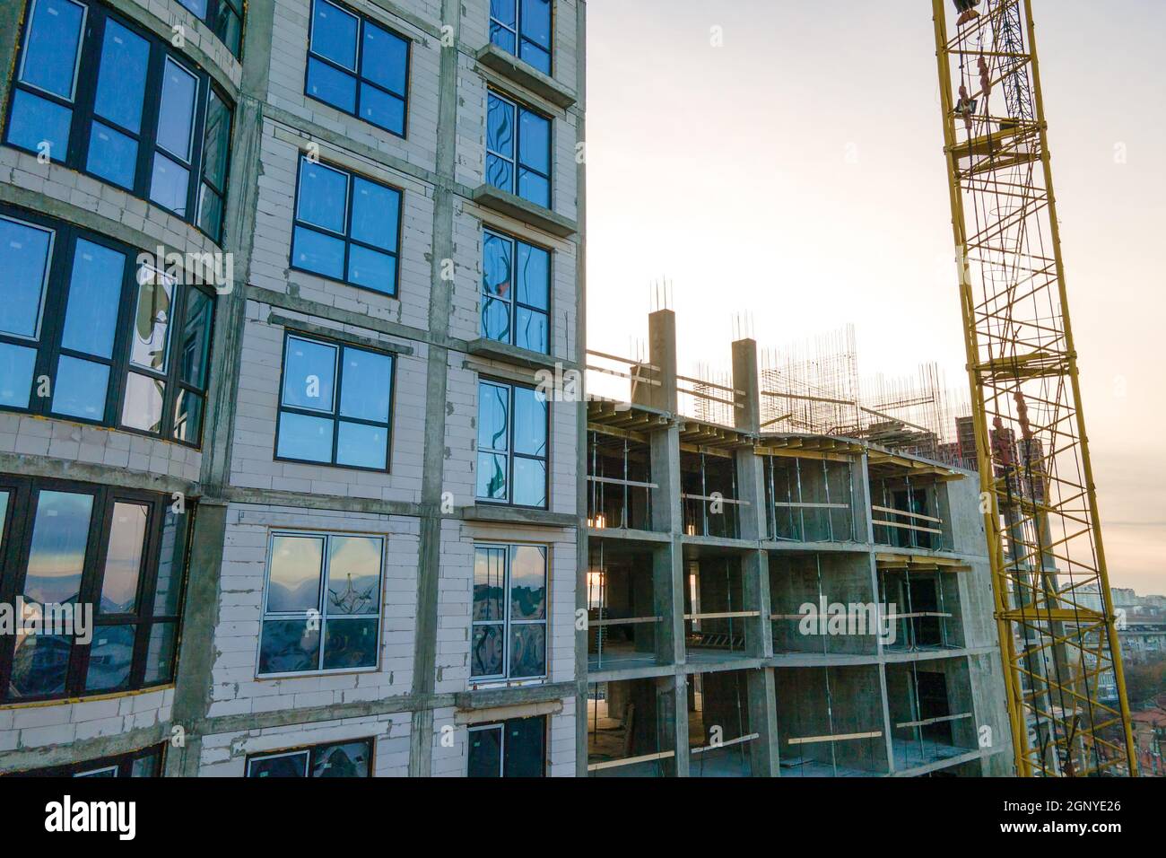 Aerial view of high tower crane and residential apartment buildings ...
