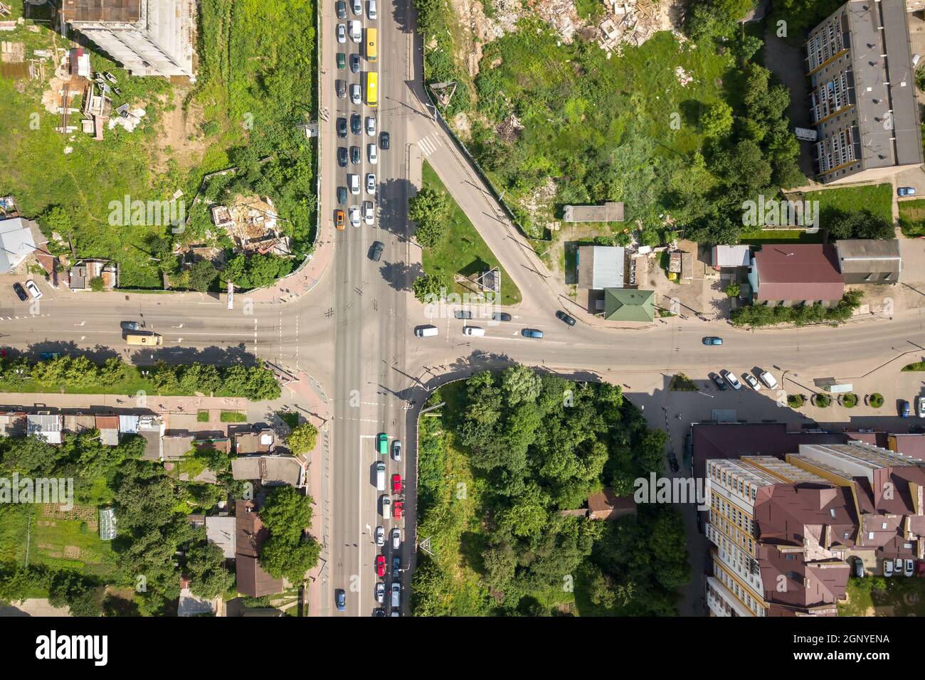 Top down aerial view of busy street intersection with moving cars ...