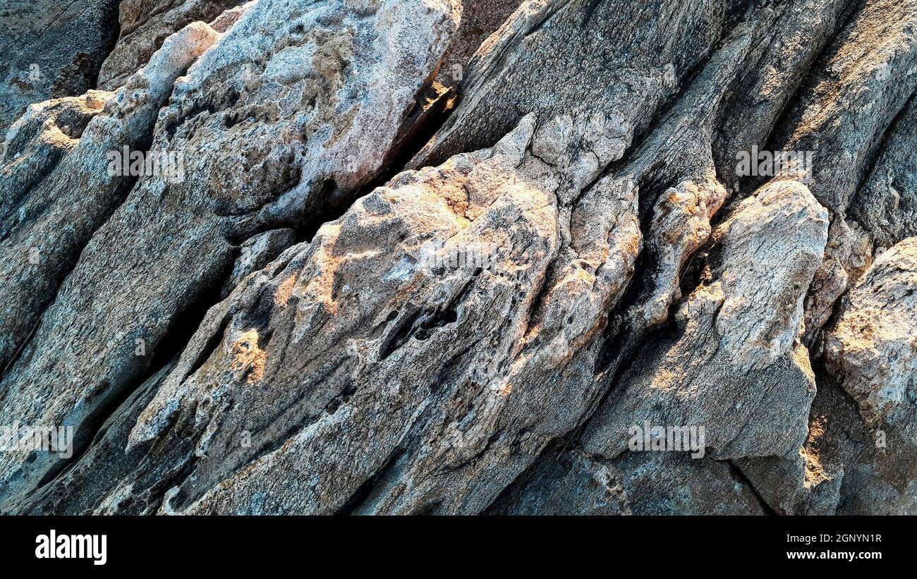Close up shot big rocks at beach coast background Stock Photo - Alamy