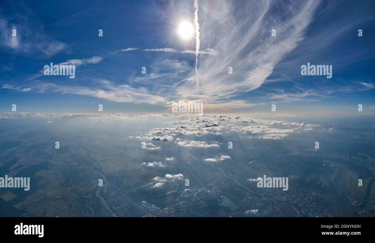 Aerial view from airplane window at high altitude of earth covered with ...