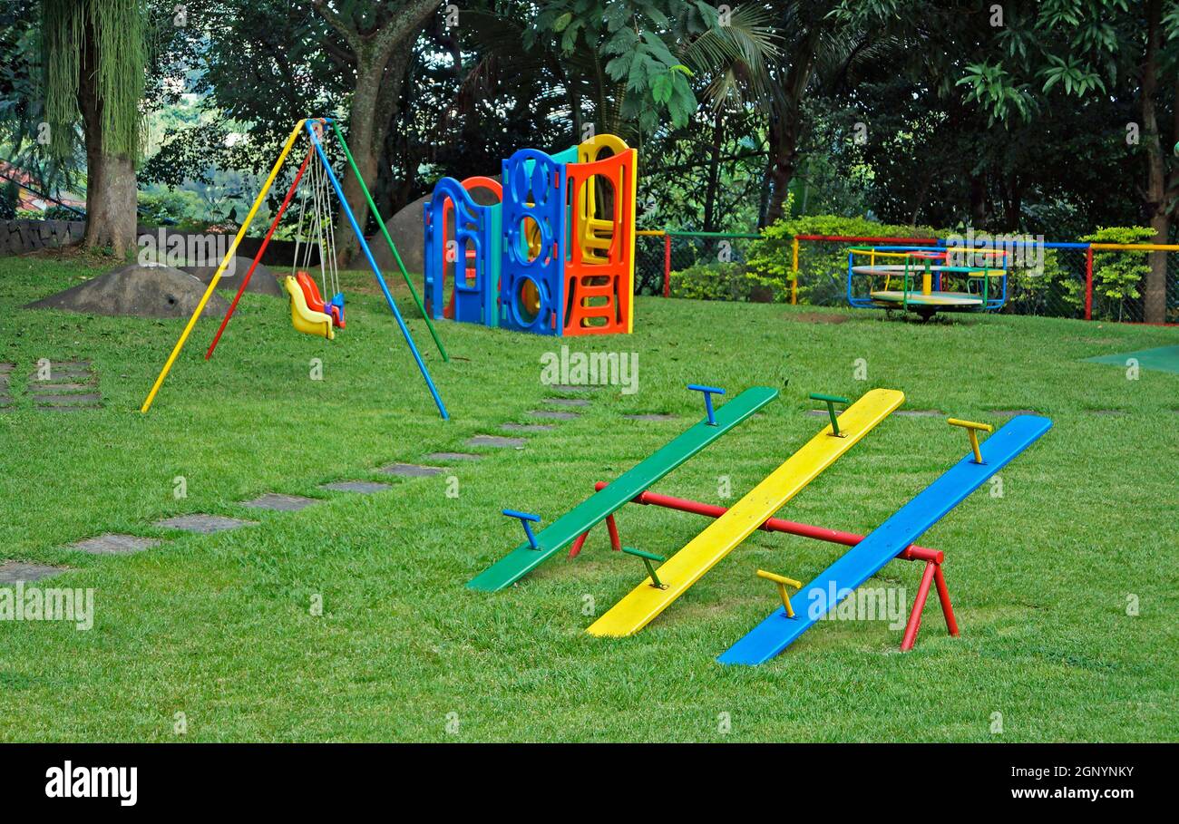 Children's playground in the garden Stock Photo - Alamy