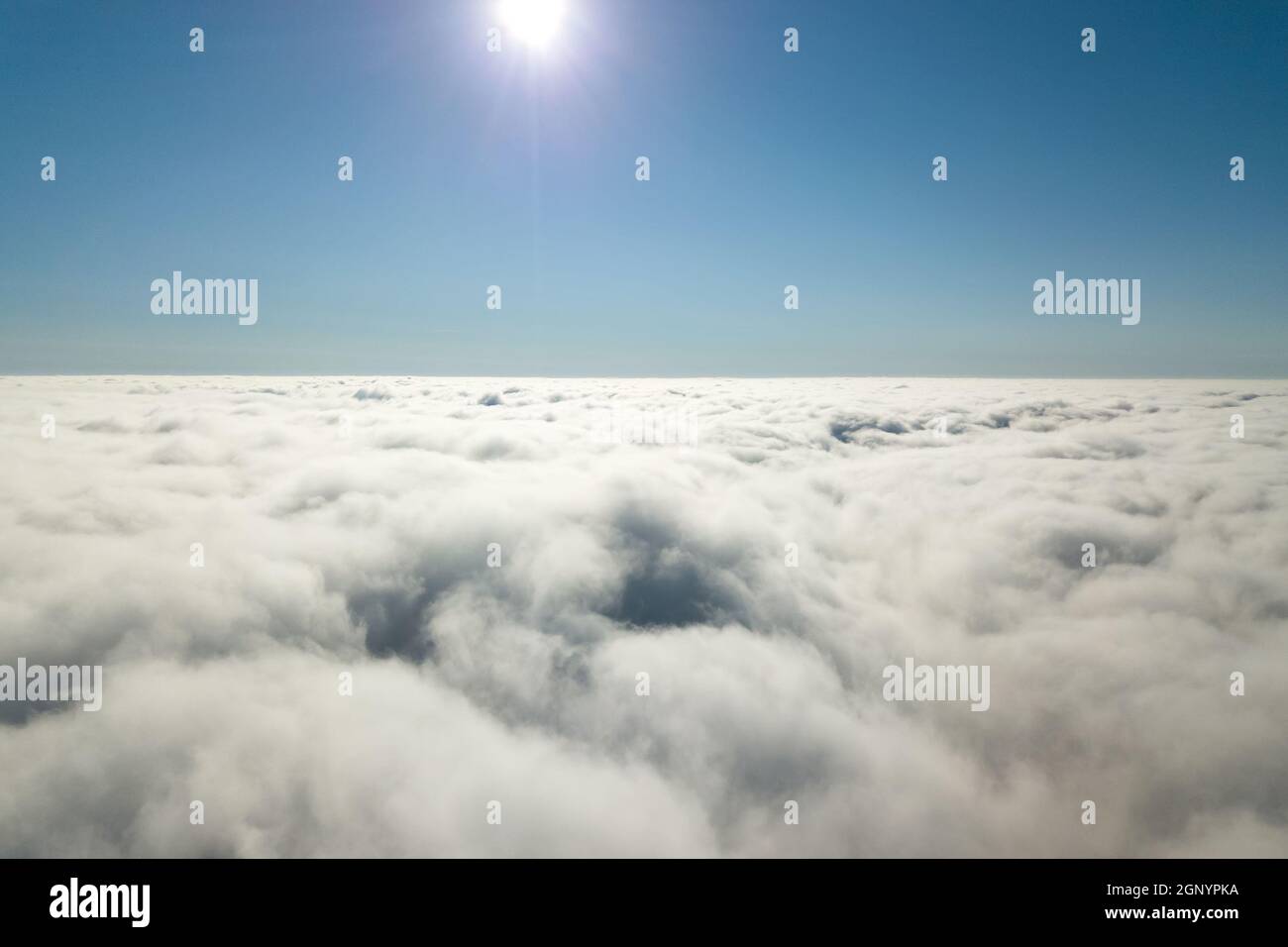 Aerial view from above of white puffy clouds in bright sunny day Stock ...