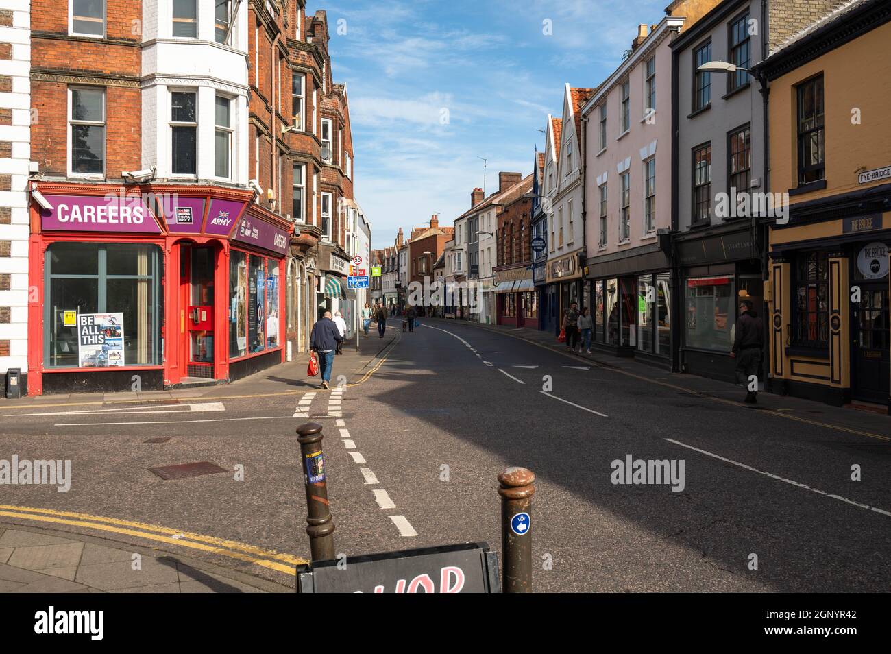 A view of Magdalen Street Norwich with shoppers either side of the road