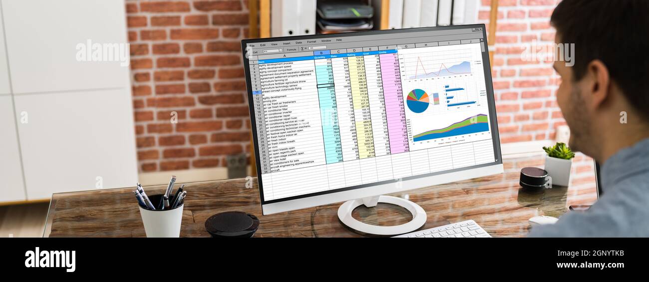 Data Analyst Using Charts And Graphs On Computer Stock Photo