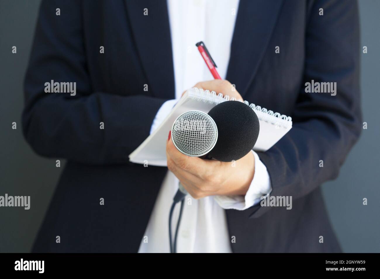 Female reporter or TV journalist at press event. Journalism concept