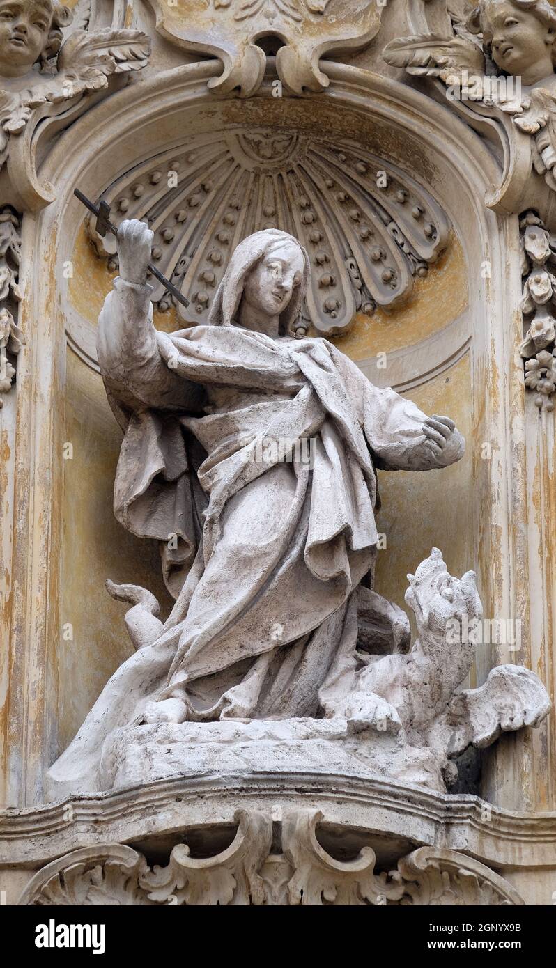 Statue of Saint Martha of Bethany on facade of Santa Maria Maddalena ...