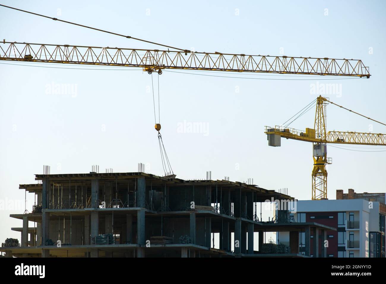 Aerial view of tower cranes and high residential apartment buildings ...