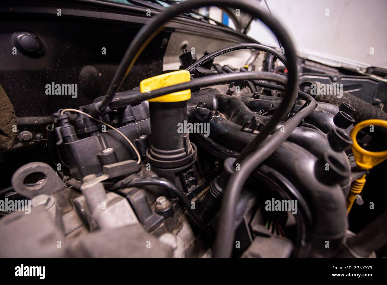 Car engine detail in a interior ready for repair Stock Photo Alamy