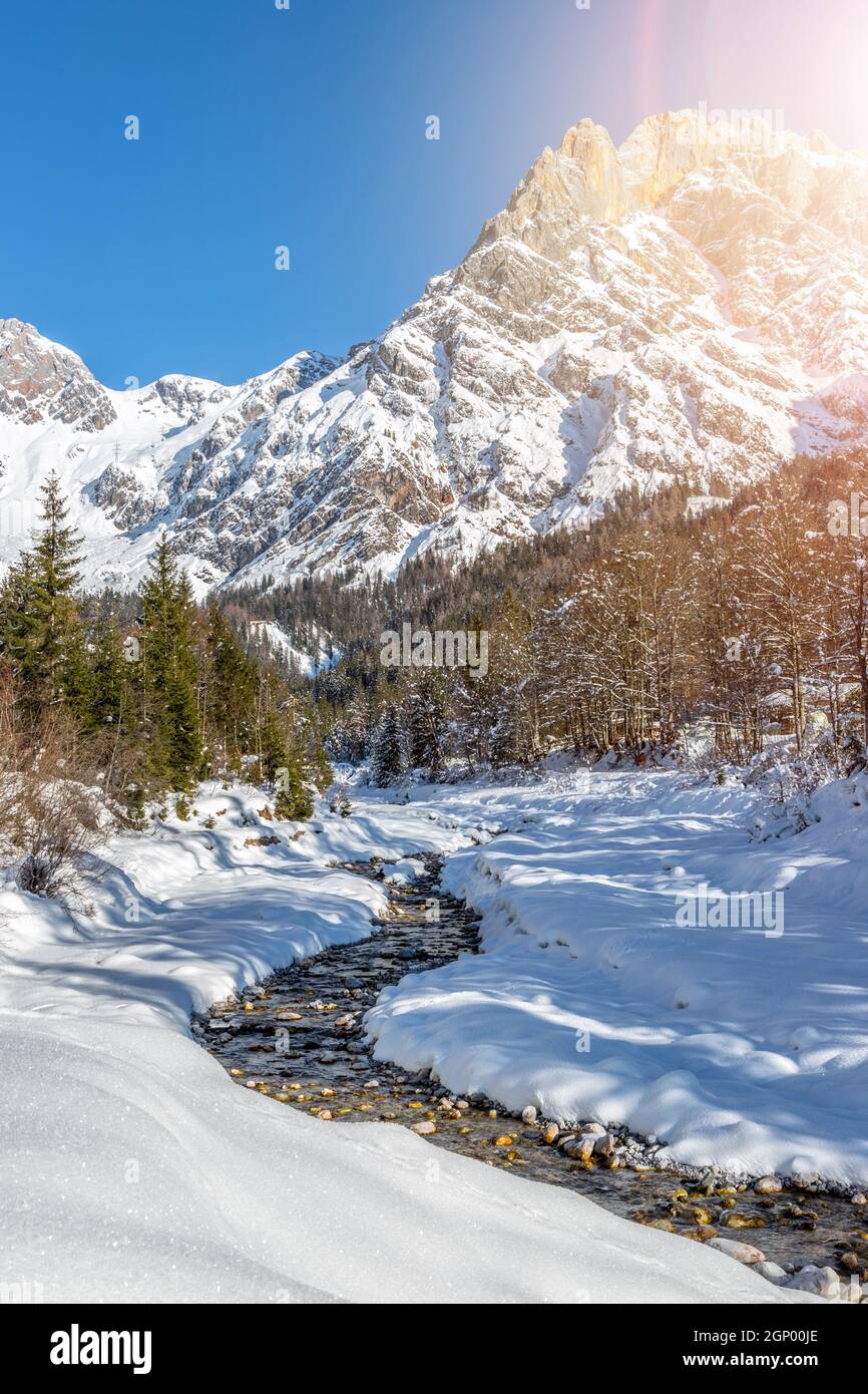 Idyllic winter landscape: stunning mountain range, beautiful river, snowy  trees and blue sky Stock Photo - Alamy, image size:866x1390