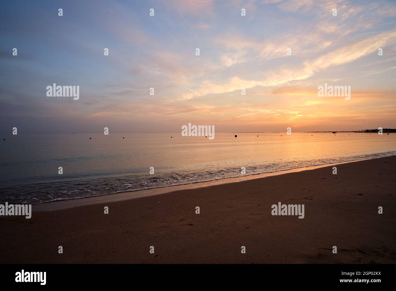 Calm sea shore with crushing waves on sandy beach at sunrise Stock ...