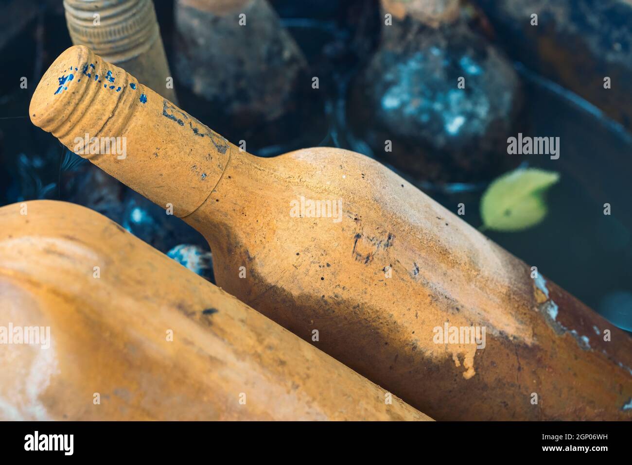 old-wine-bottles-with-limescale-in-a-fountain-stock-photo-alamy