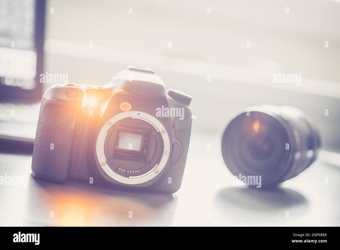 Professional reflex camera on a table, camera sensor. Lenses in the ...