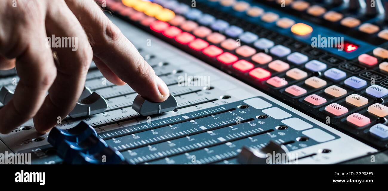 Professional music production in a sound recording studio, mixer desk ...