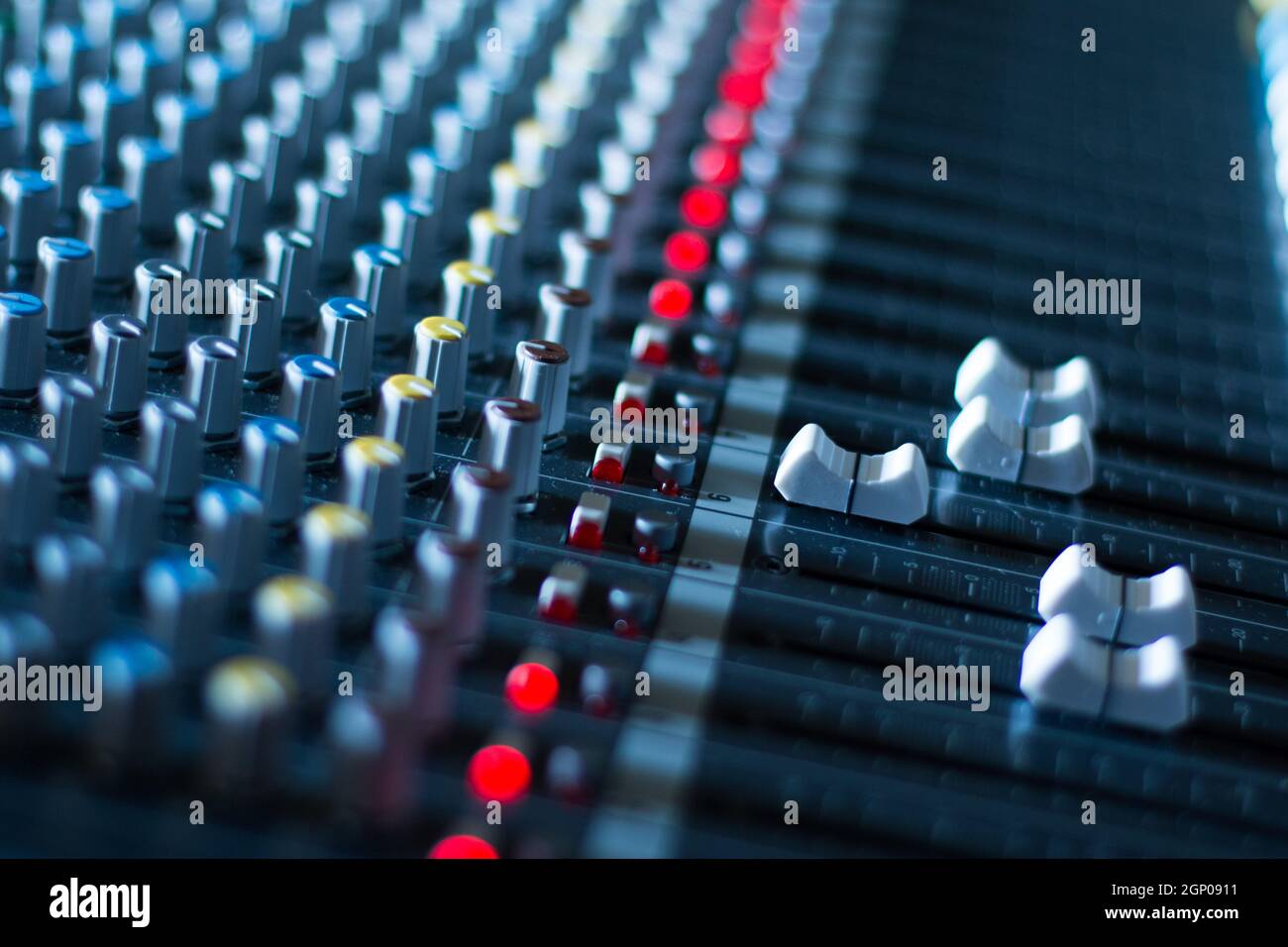 Professional music production in a sound recording studio, mixer desk ...