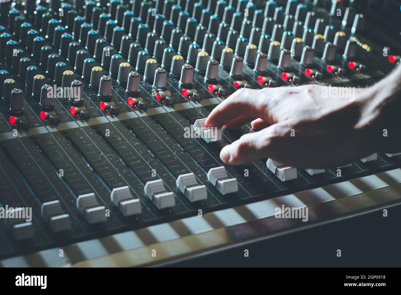 Professional music production in a sound recording studio, mixer desk ...