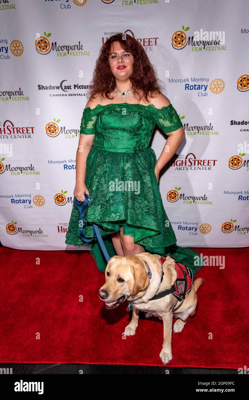 Kaitlyn August with dog Mowgli attends Suzanne DeLaurentiis Productions Film Premiere 'Reed's Point' at Studio Movie Grill, Simi Valley, CA on Septemb Stock Photo