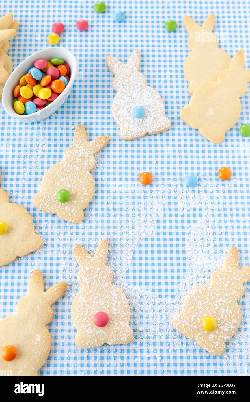 Bunny shaped sugar cookies with colorful chocolate lentils Stock Photo ...