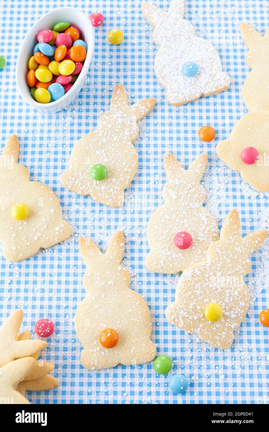 Bunny shaped sugar cookies with colorful chocolate lentils Stock Photo ...