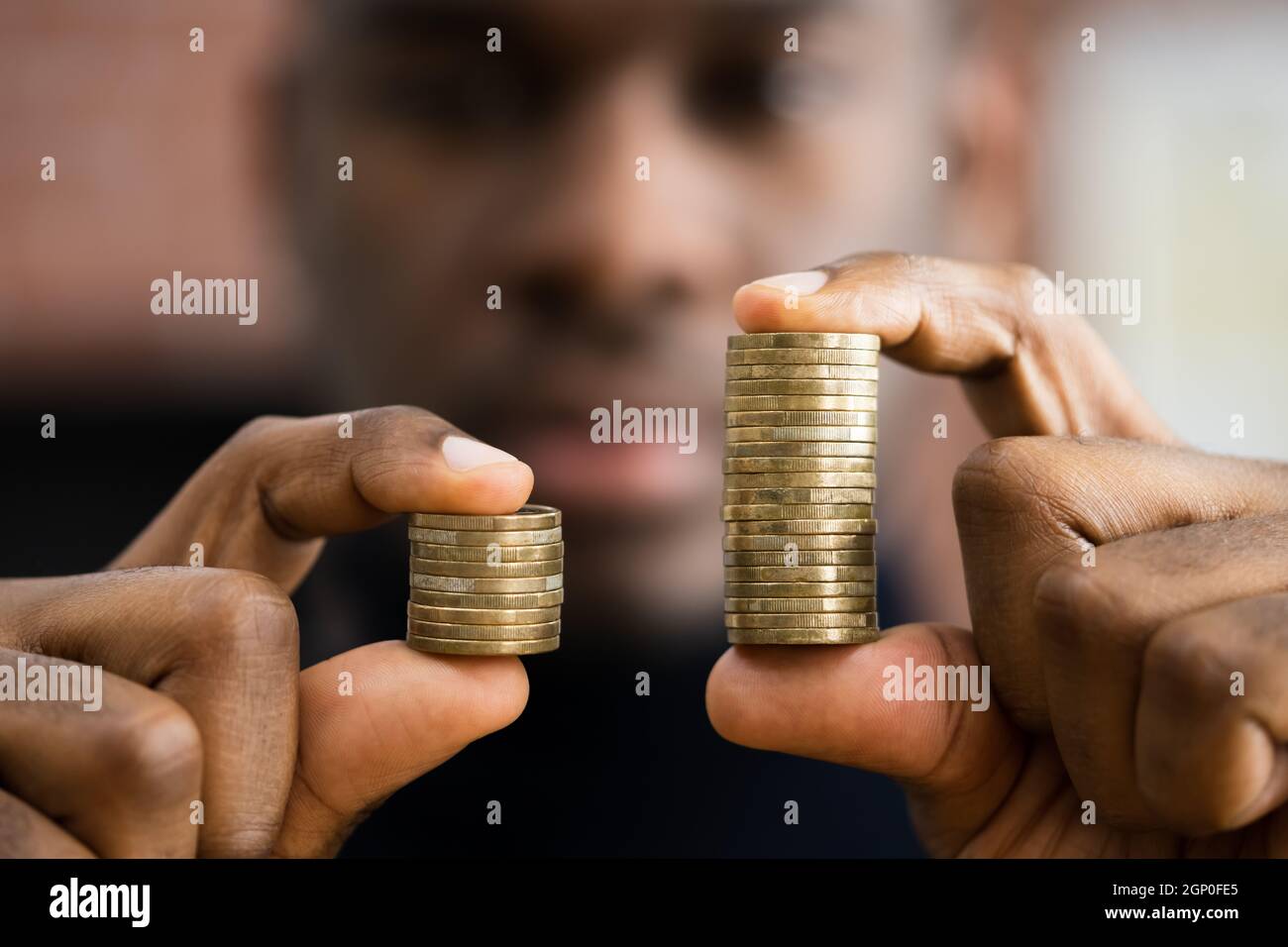 African American Money Disparity And Pay Gap Stock Photo