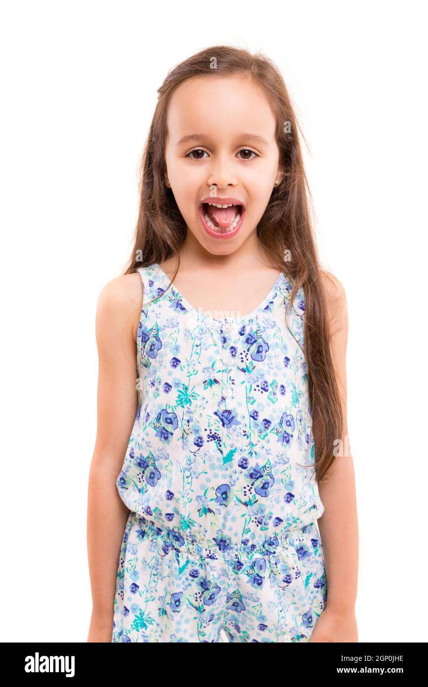 Small girl playing and making a silly expression - isolated over white Stock Photo