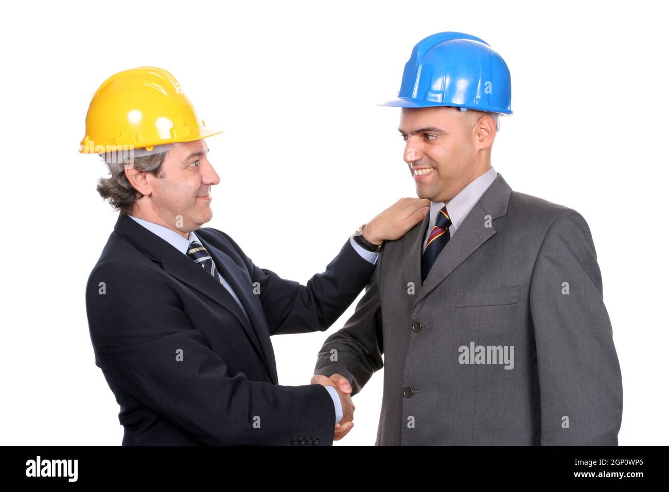 Two Engineers or Architects, closing new project, isolated in white background Stock Photo