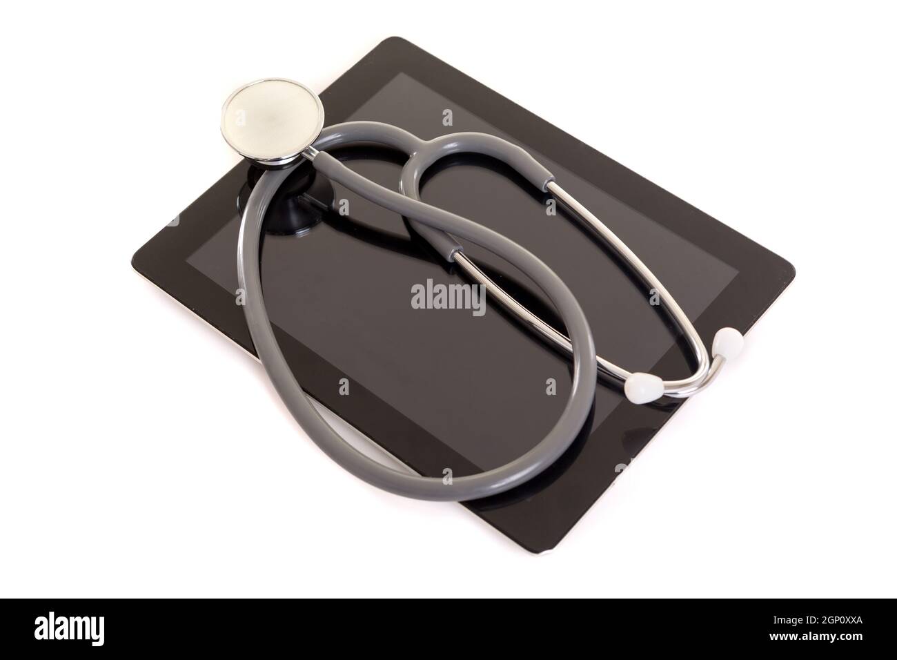 Stethoscope over a tablet computer, isolated over white background ...
