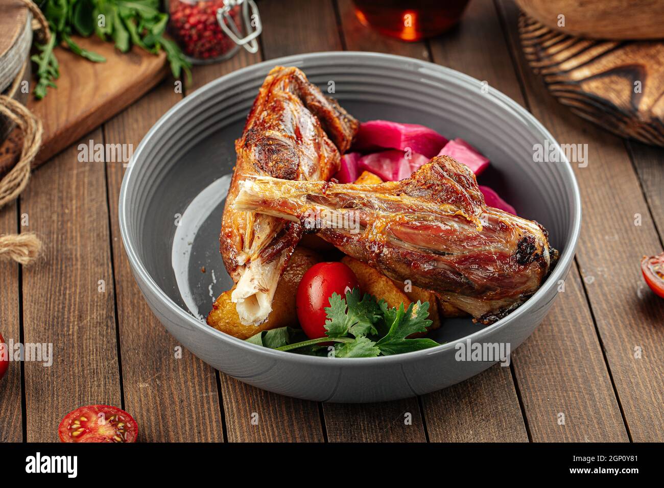 Gourmet prepared lamb legs dish with vegetables Stock Photo Alamy